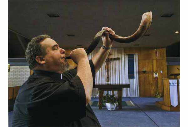 Fr. Sanchez  blowing the shofar